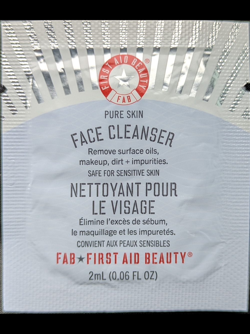 First Aid Beauty Face Cleanser Sachet – White with Red Logo